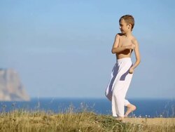 boy practicing martial arts on the coast Stock Footage