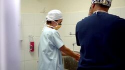 Surgeons washing hands and talking before surgery Stock Footage