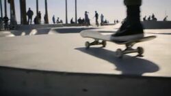 moving dolly shot of venice skatepark behind railings venice california Stock Footage