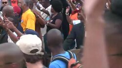 CLEAN : Protesters keep up pressure as police shooting case starts News Clip