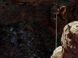 WS PAN TD Man jumps of cliff and does backflip / Moab, Utah, United States   Stock Footage