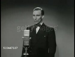 1949: SWEDEN RADIO:  INT MS Radio studio door closing. REPRISAL: INT VS Swedish baritone singer Bertil Boo (1914-1996) standing at microphone. MS Radio operator signaling. VS Boo singing (SOT). INT MS Family listening to radio (Boo singing VO). Instructional Video