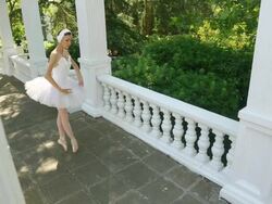 Ballerina dancing on a beautiful park alley Stock Footage