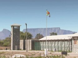 WS View of Prison on Robben Island with Table Mountain / Cape Town, Western Cape, South Africa Stock Footage