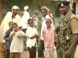 Boys and soldier standing on the street Stock Footage