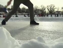 Schloss Nymphenburg, man shot curling stick,his legs,  some other people, snow Stock Footage