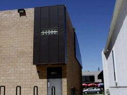 WS SLO MO Two men perform flips between two buildings / Denver, Colorado, United States Stock Footage