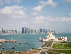 Elevated view over the Museum of Islamic Art and the Dhow harbour to the modern skyscraper skyline, Doha, Qatar, Middle East Stock Footage