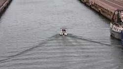 Motor boat moving on the channel Stock Footage