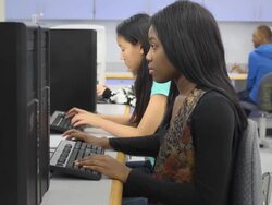 Female Student Works on Computer in Classroom Stock Footage