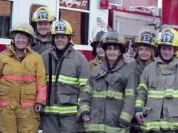 PAN, Group of Volunteer Fire Fighters in Front of Fire Truck, Eastville, Virginia, USA Stock Footage