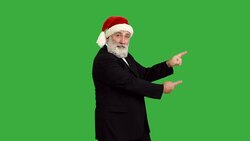 adult senior beard man shows copy space  in a hat santa claus  on a green background Stock Footage