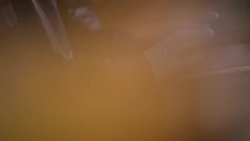 Hands of students using tablets to conduct chemistry lab experiment Stock Footage