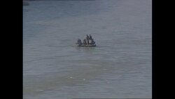 People crossing a river in Afghanistan News Clip