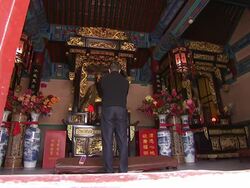 A worshiper bows at a Taoist altar in Beijing. Stock Footage