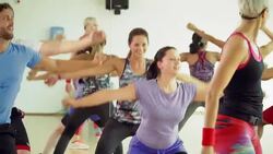 Instructor leading exercise class in gym studio Stock Footage