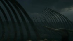 Dinosaur bones lie in desolate field beneath a dark sky in a computer generated animation. Stock Footage