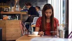 Woman hand using digital tablet at coffee cafe Stock Footage