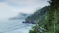 Heceta Lighthouse in the fog wide shot Stock Footage