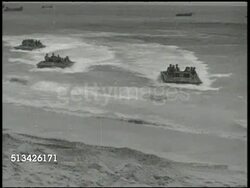 1944: BATTLE OF KWAJALEIN: VS U.S. 7th Marine Division soldiers in amphibious landing crafts approaching Kwajalein beach, U.S. Navy battleships firing cannons, soldiers landing on beach, combat cameraman filming from beach. WWII, Pacific Front Instructional Video