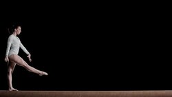 LD Female gymnast doing performing on balance beam Stock Footage