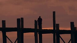 W/S monk in U Bein bridge, Myanmar Stock Footage
