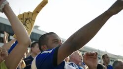 Stadium crowd cheers at football game Stock Footage