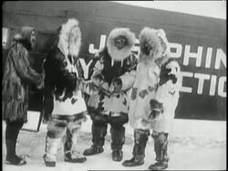 Admiral Richard E Byrd and pilot Floyd Bennett climb into a Fokker F-VII plane before attempting to fly over the North Pole in 1926. Stock Footage