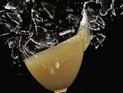 CU SLO MO Glass of orange juice being exploded / Vieux Pont, Normandy, France  Stock Footage