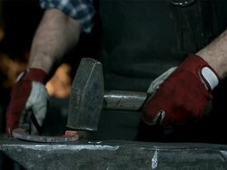 HD Super Slow-Mo: Blacksmith Forging A Horseshoe Stock Footage