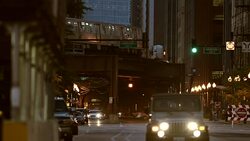 A sign spelling TRUMP looms over Wabash Avenue at night in Chicago. Stock Footage