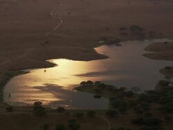AERIAL WS TD Rural landscape at sunset with reflections in lake / Evora, Portugal Stock Footage