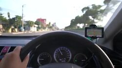 Driving car With GPS front view at sunset, Driving Stock Footage