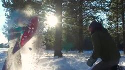 Small child playing in the snow with her father during winter Stock Footage
