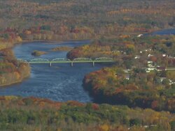 WS AERIAL ZI PAN View of wooded area with autumn color at near Penobscot river / Maine, United States Stock Footage