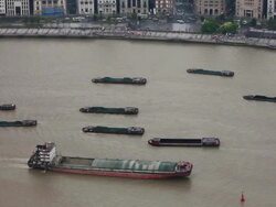 WS HA View of multiple barges sailing along river through Shanghai/ Shanghai,  China Stock Footage