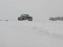 WS View of pickup truck moving during winter / Minneapolis, Minnesota, USA Stock Footage