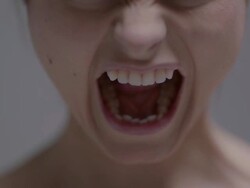 Close up portrait of woman gritting her teeth and yelling Stock Footage