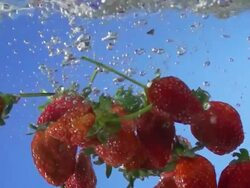 Strawberries Splashing Into Water (Super Slow Motion) Stock Footage
