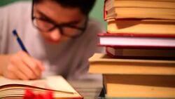 Boy doing homework Stock Footage