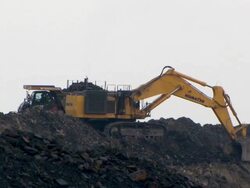 MS View of  digger excavating and  loading  trucks in opencast mine / Ffos-y-fran / Merthyr Tydfil, Glamorgan/Wales, United Kingdom Stock Footage