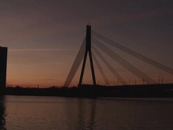 WS PAN View of Daugava River with bridge at sunset / Riga, Latvia Stock Footage