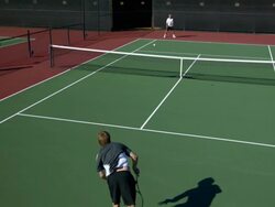 SLO MO, HA, WS, Two young men playing tennis, Santa Barbara, California, USA Stock Footage