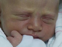 ECU, Newborn girl wrapped in blanket, Georgia, Atlanta, USA Stock Footage