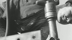 MONTAGE Shipbuilders and welders working beneath large steel truss with power tools / United Kingdom Stock Footage