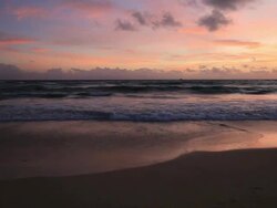 Good Looking Young Couple walking by the Sea at Sunset Stock Footage