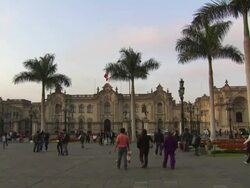 "View of the Government Palace of Peru/House of Pizarro [Casa de Pizarro], from center of Plaza Mayor/Plaza de la Armas of Lima, with lots of tourists milling around, Lima, Peru" Stock Footage