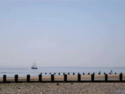 BRIDLINGTON NORTH BEACH HARBOUR WALL AND LIGHTHOUSE Stock Footage