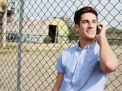 Male Teenager talking on mobile phone Stock Footage
