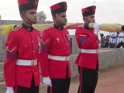 MS Montage of honour guard in full military dress lowering national Sri Lanka flag at dusk on 'Galle Face Green' / Colombo, Western Province, Sri Lanka Stock Footage